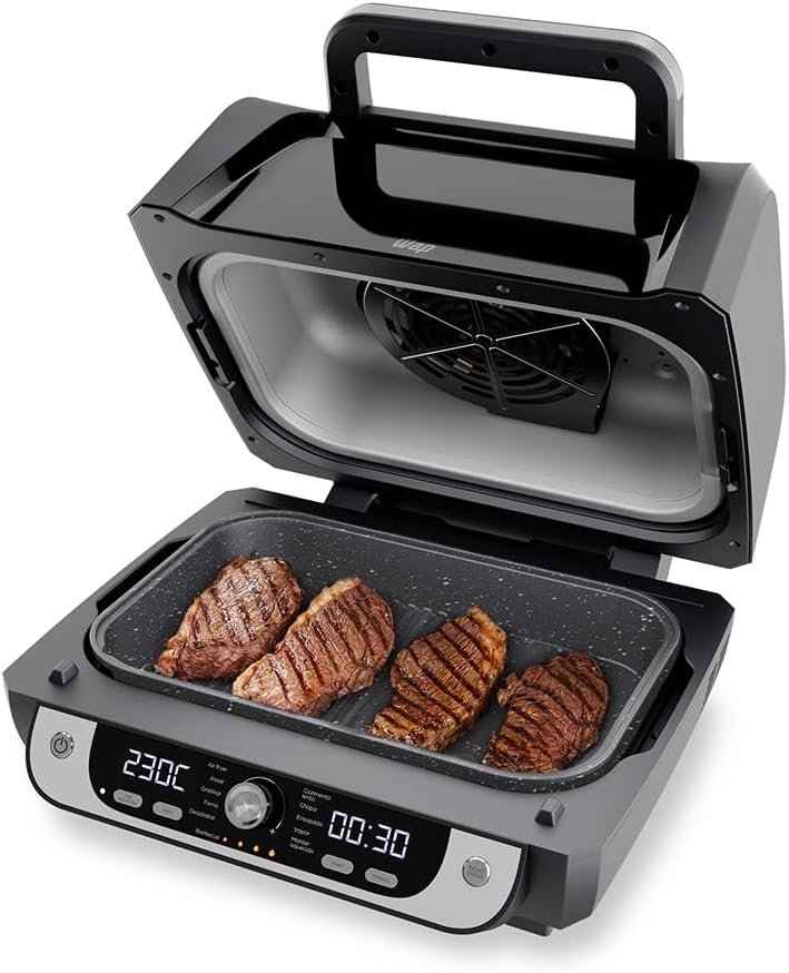 WAP Barbecue 12 em 1 de 10 litros aberta com bifes na grelha